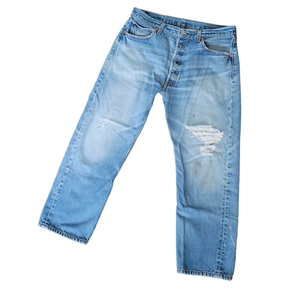 501 Levi’s straight distressed jeans.
Medium wash, button fly.